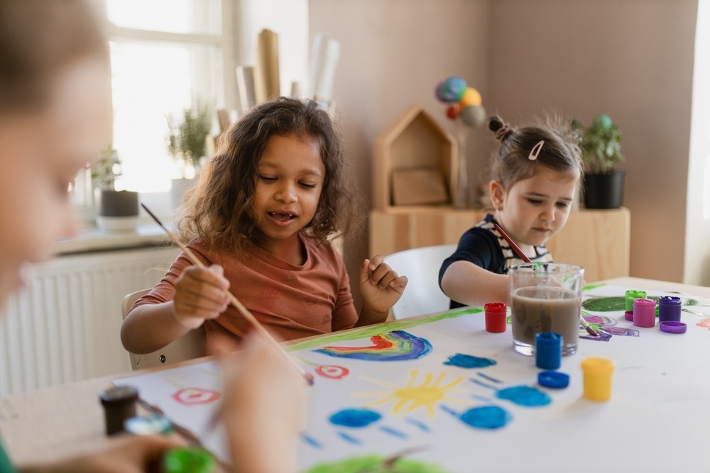 Children enjoy fun activities at a child-care facility. What are the potential consequences of a child-care administrator license defense case?