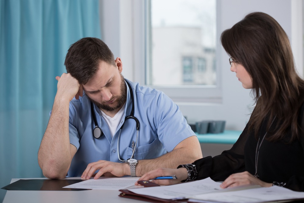 A lawyer meeting with a physician facing disciplinary action for a common reason.