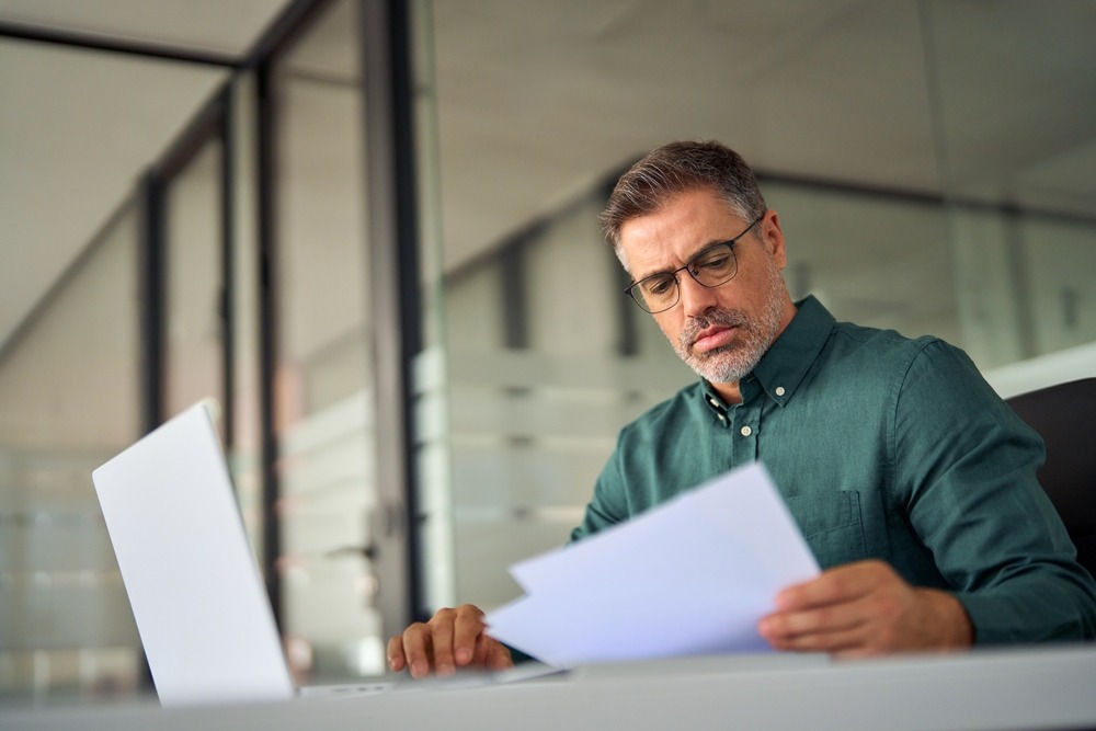 A physician license defense lawyer conducts research to gather important evidence.